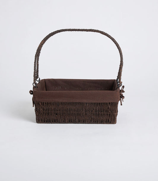 Dark brown handwoven wicker basket with fabric lining and curved handles, ready for gift hampers