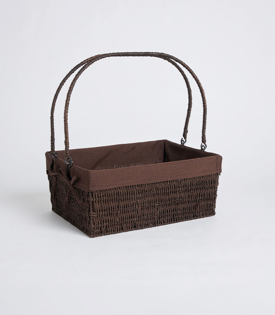 Handwoven dark brown wicker basket with double handles and removable fabric lining