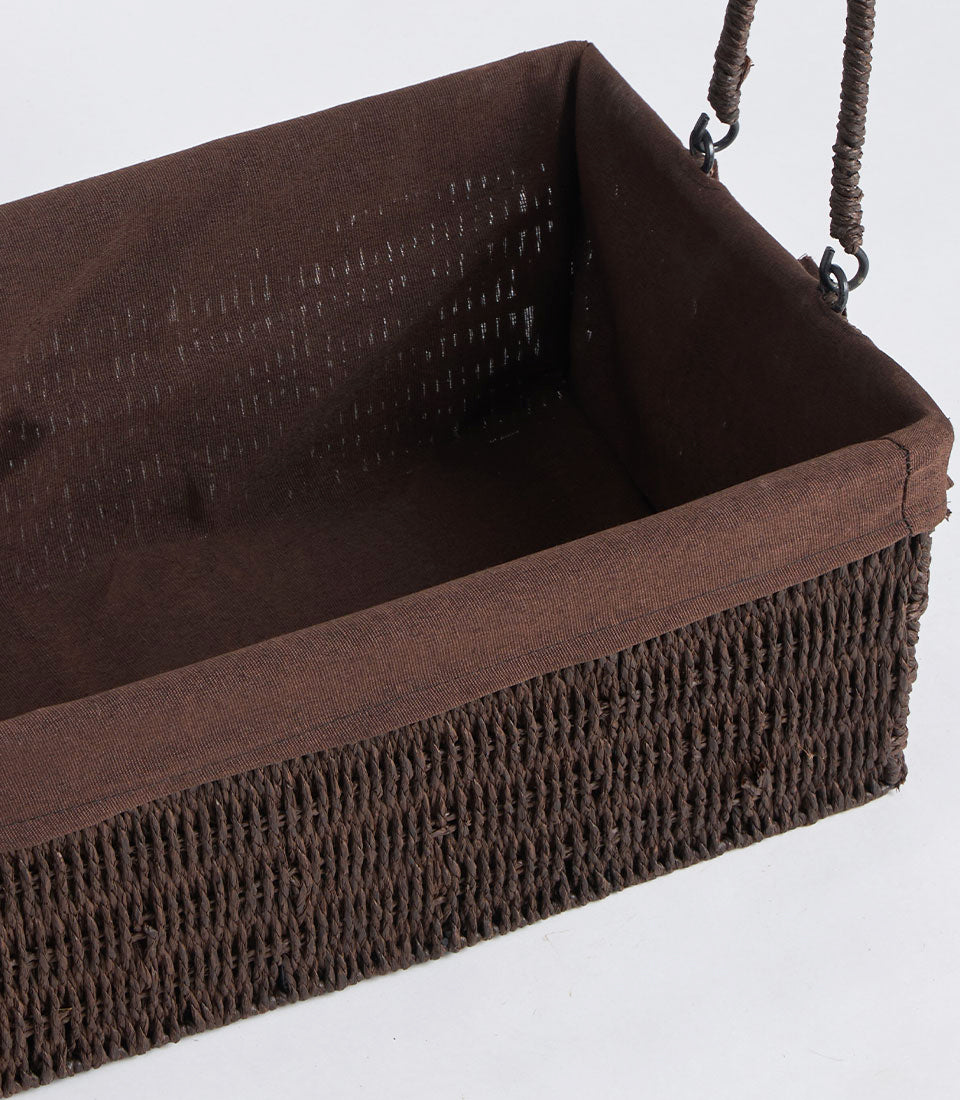 Dark brown handwoven wicker basket with fabric lining and double handles, perfect for luxury gift hampers