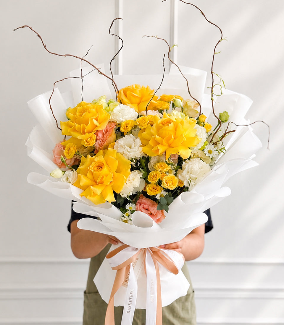 A radiant rose bouquet featuring vibrant yellow garden roses, delicate white lisianthus,