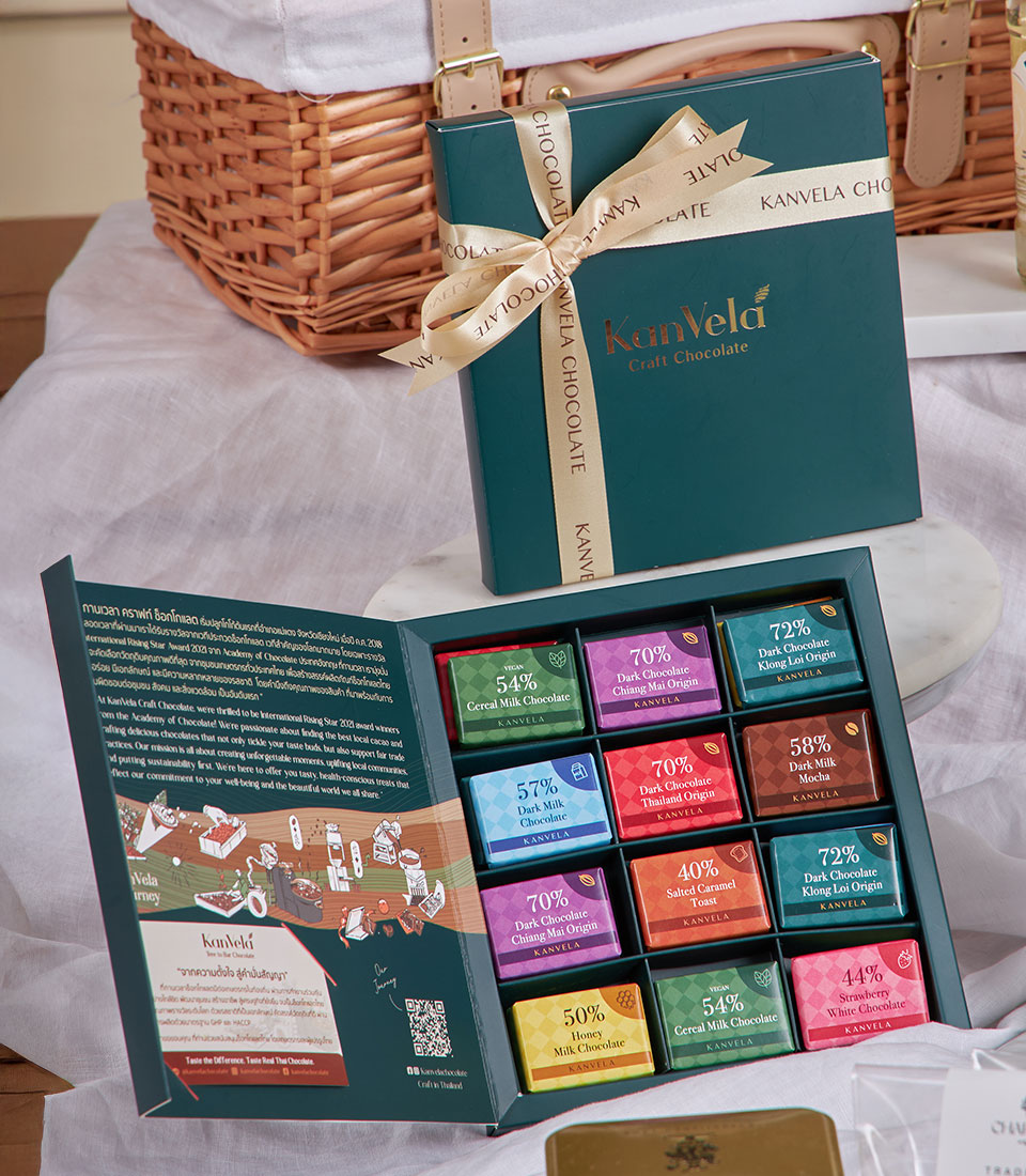 Premium tea and gourmet cookies luxury hamper with dark teal packaging and gold ribbon, ideal New Year gift