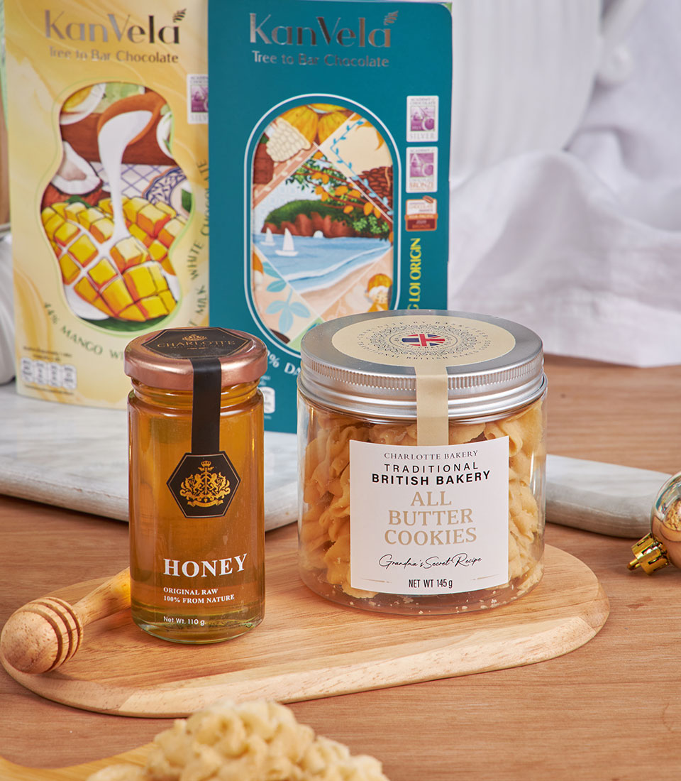 Luxury tea and cookie gift hamper with honey, all-butter cookies, and artisan chocolate for New Year gifting