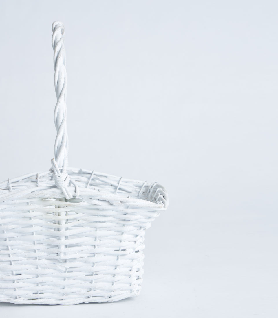 White wicker flared basket with twisted handle for premium gift hampers