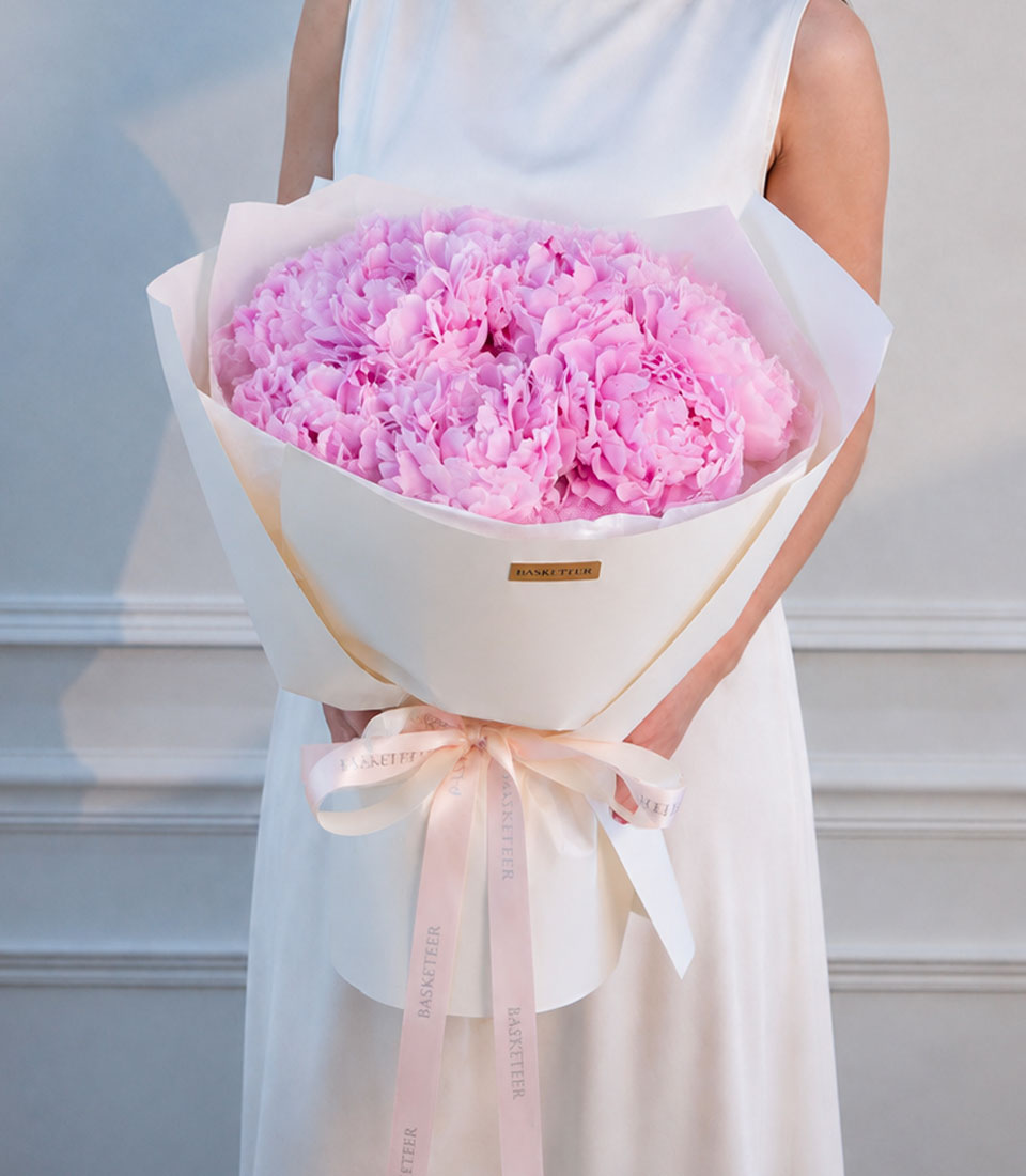 Luxurious pink peony bouquet by Flowers by Basketeer, elegantly wrapped