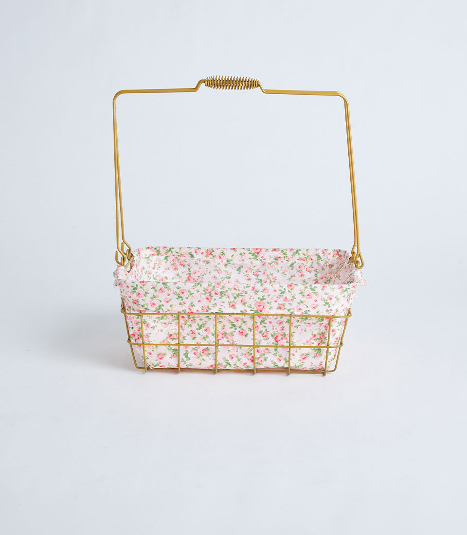 Gold rectangular wire basket with floral fabric lining and curved handle for luxury gifting