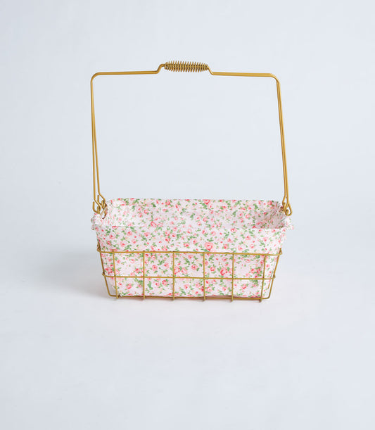 Gold rectangular wire basket with floral fabric lining and curved handle for luxury gifting