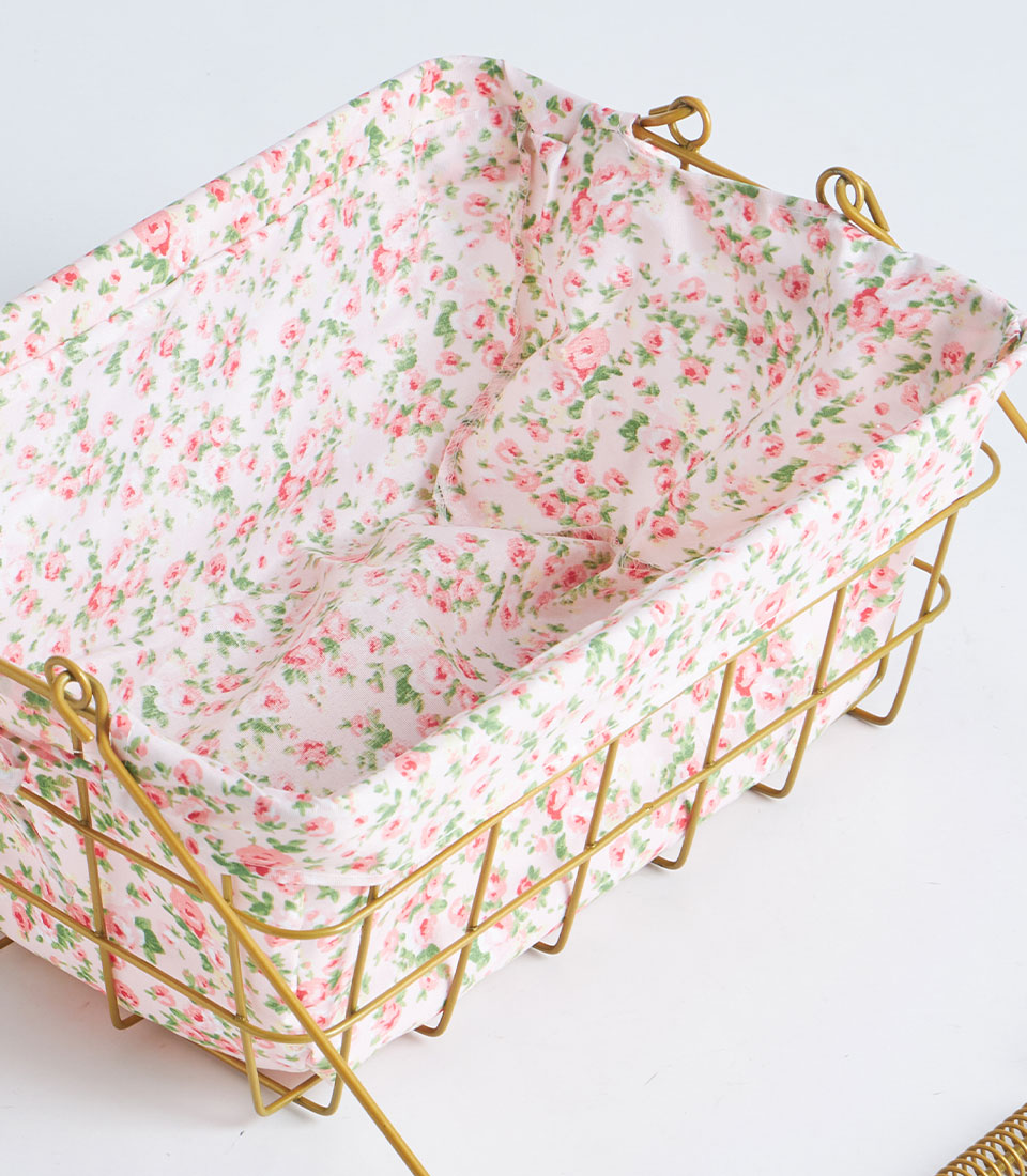 Gold wire rectangular basket with pink rose fabric lining and metal handle