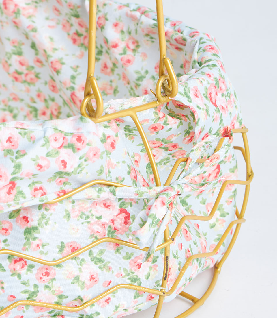 Gold metal oval basket with floral fabric lining and handle for luxury gift hampers