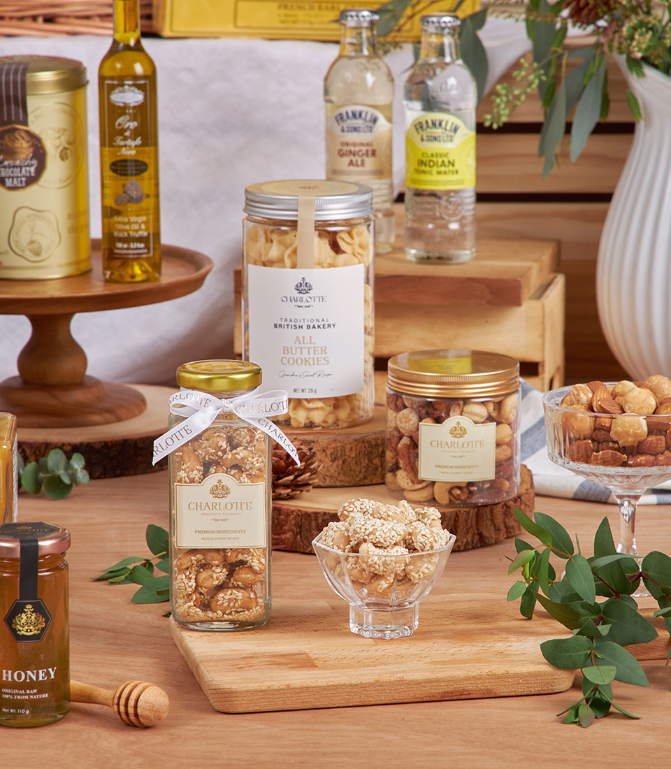 Golden luxury breakfast hamper with British butter cookies, premium nuts, truffle olive oil, honey, and gourmet beverages
