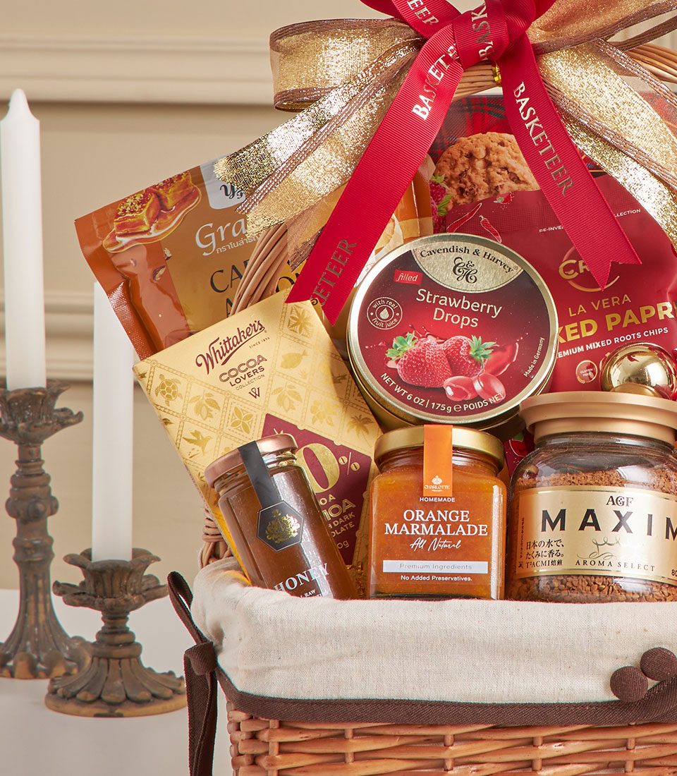 Luxury wicker gift basket with Walkers truffle chips, artisan chocolate, gourmet jams, honey, and coffee for New Year gifting