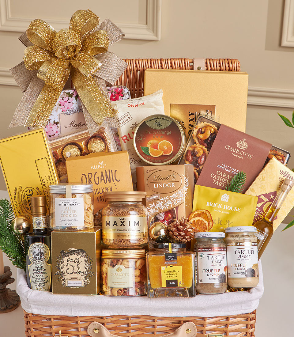 Luxury wicker gift basket with gourmet truffles, chocolates, artisan jams, and fine food for New Year celebration