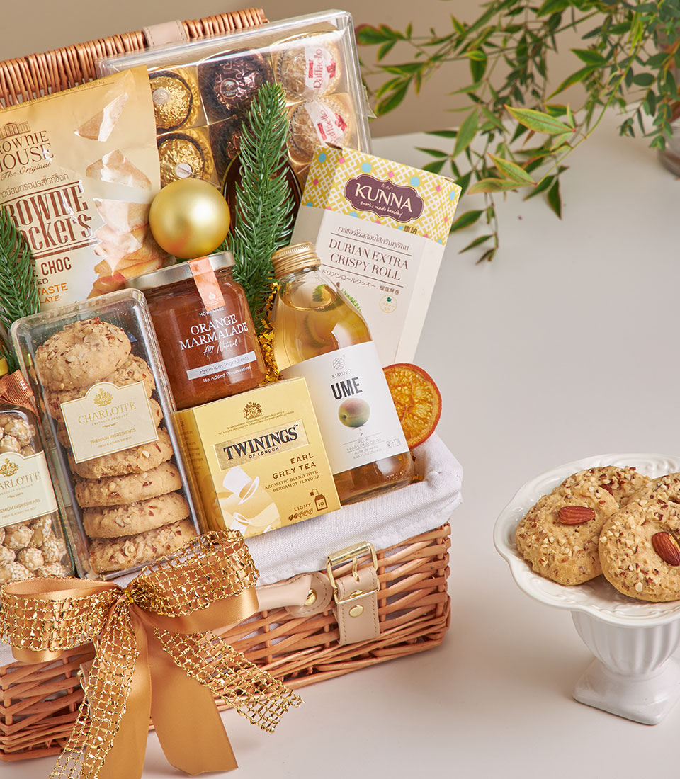 Premium New Year gift hamper with truffle chips, gourmet cookies, chocolate, and artisan treats in woven wicker basket
