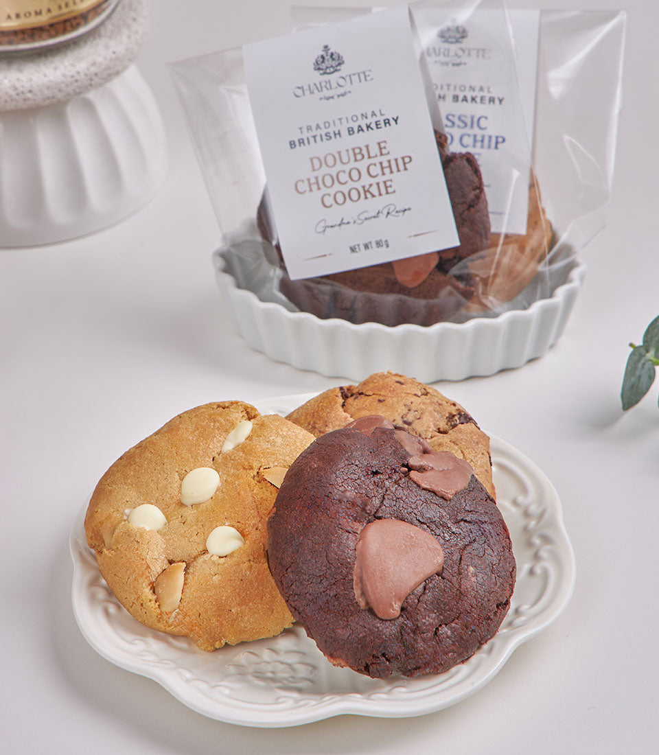 Luxury chocolate and tea hamper with artisan cookies, dark chocolate chunks, and white chocolate almonds for New Year