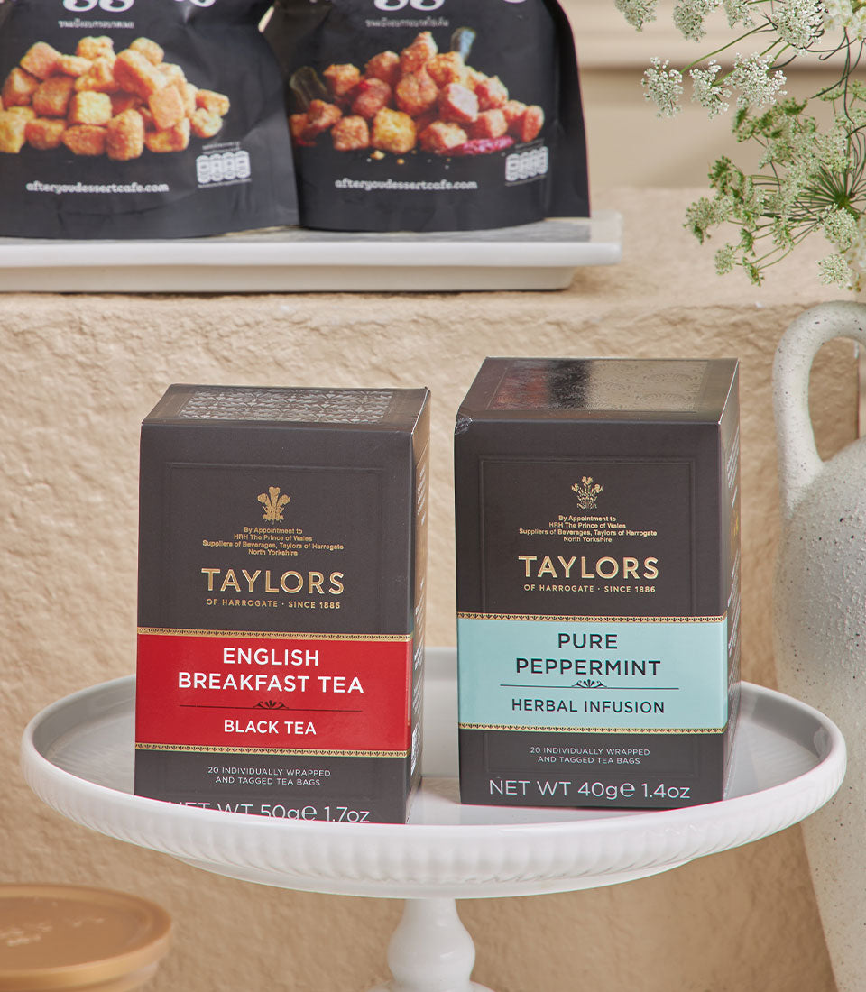Premium tea and gourmet treats luxury hamper with English Breakfast and peppermint tea, artisan snacks for New Year