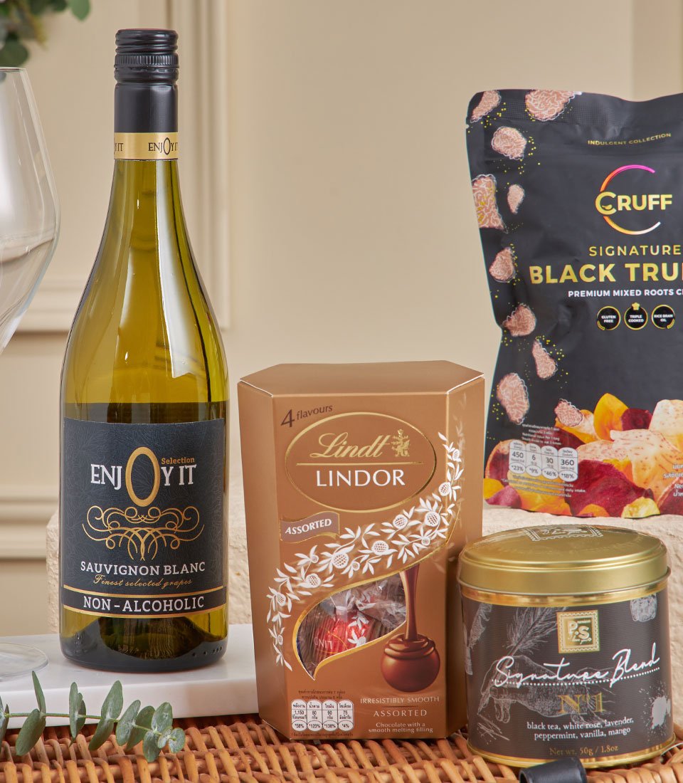 Luxury chocolate and tea hamper with Lindt assortment, premium black truffle chips, and signature blend tea for New Year