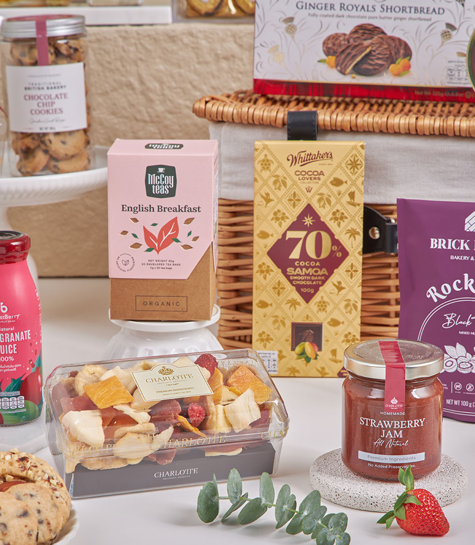 Luxury Prosperity New Year gourmet hamper with wicker basket, artisan chocolates, English breakfast tea, and premium dried