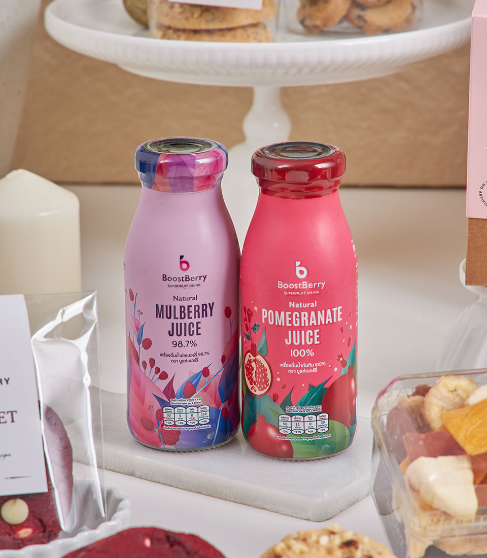 Luxury New Year gourmet table with BoostBerry mulberry and pomegranate juices, artisan cookies, and dried fruit