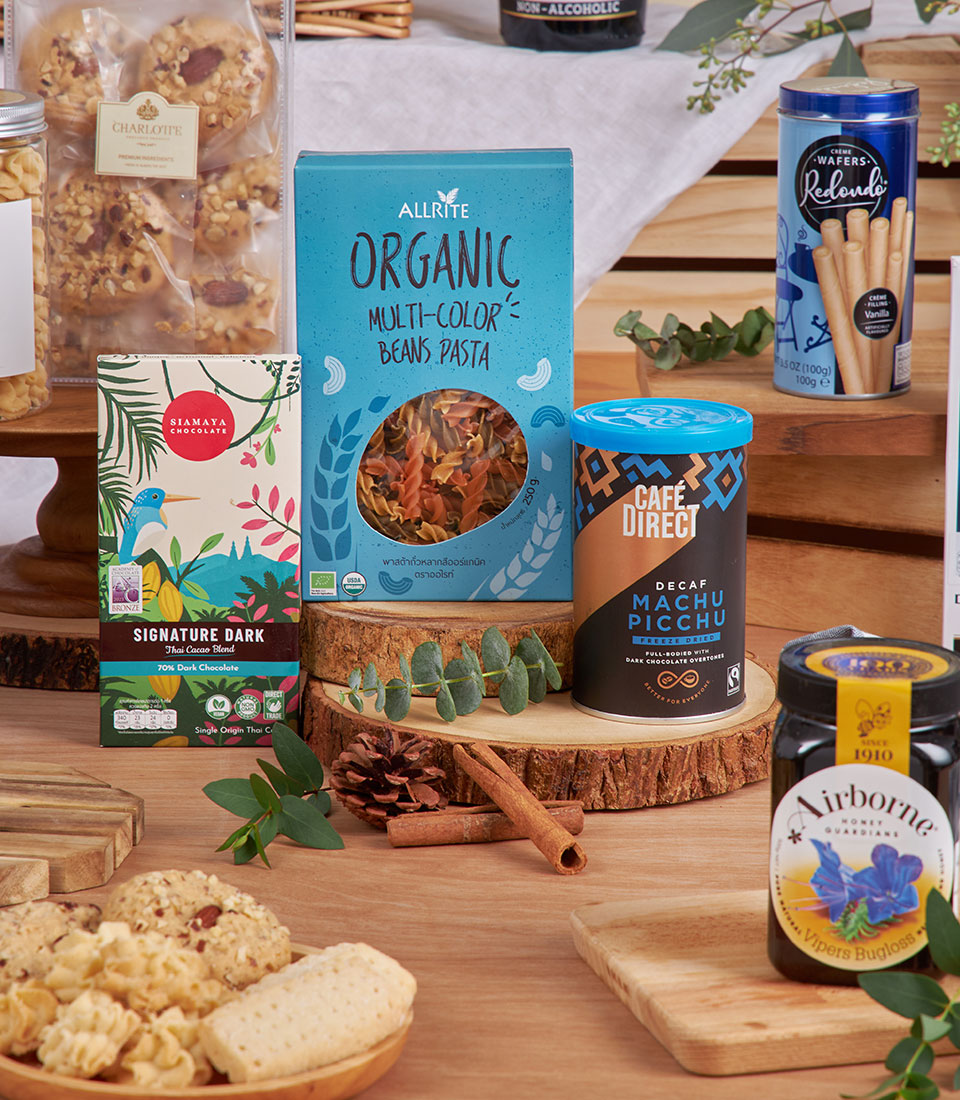 Blue and gold luxury gift basket with gourmet pasta, specialty coffee, honey, and artisan treats for New Year celebrations