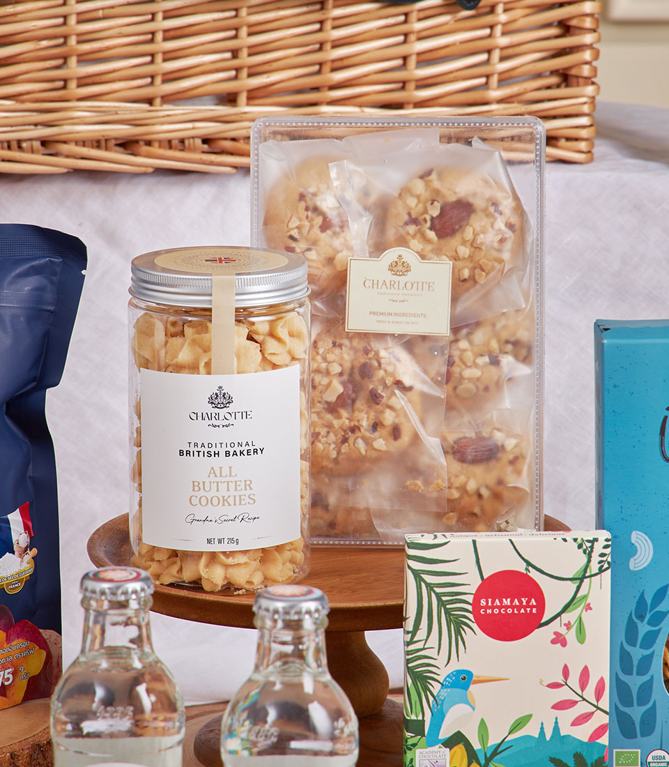 Luxury gourmet gift basket with manuka honey, British butter cookies, chocolate, and sparkling treats for New Year