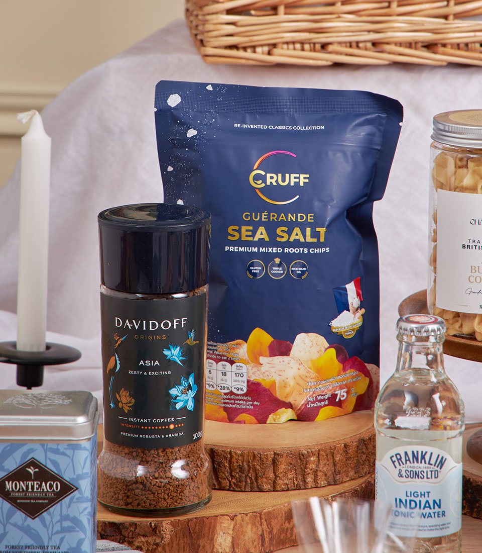 Blue Gold luxury New Year gift basket with gourmet chips, Manuka honey, instant coffee, and tonic water