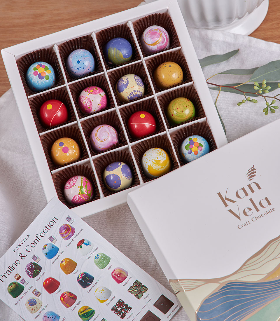 Artisanal hand-painted chocolate truffles with London and Thai tea flavors in luxury gift box