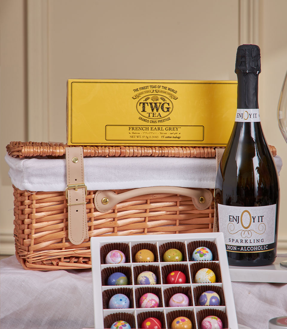 Champagne-style luxury chocolate gift basket with sparkling beverage, French earl grey tea, and wicker picnic hamper for New