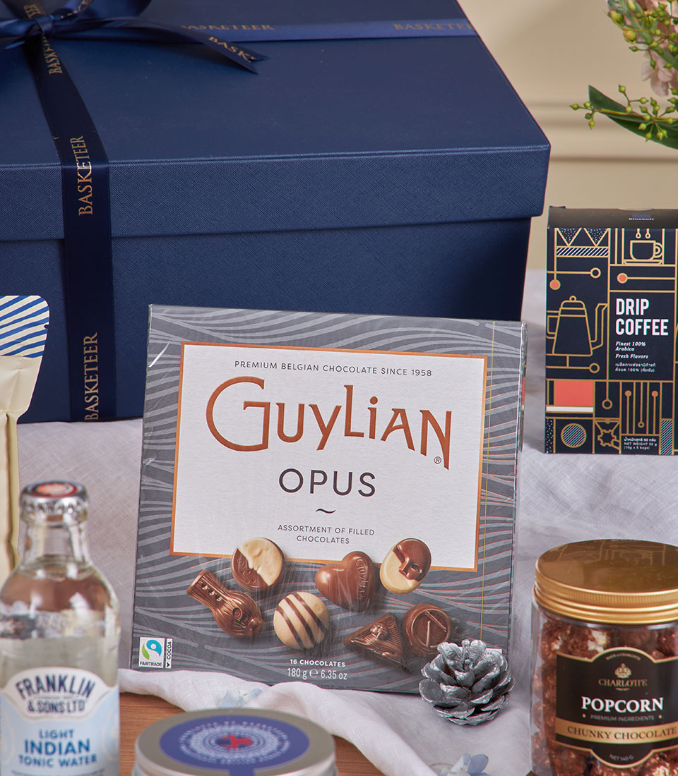 Luxury New Year gift basket with gourmet chocolates, artisan coffee, premium tonic water, and chocolate popcorn