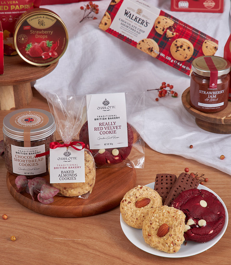Red velvet gourmet gift basket with British artisan cookies, jam, and sweets for New Year