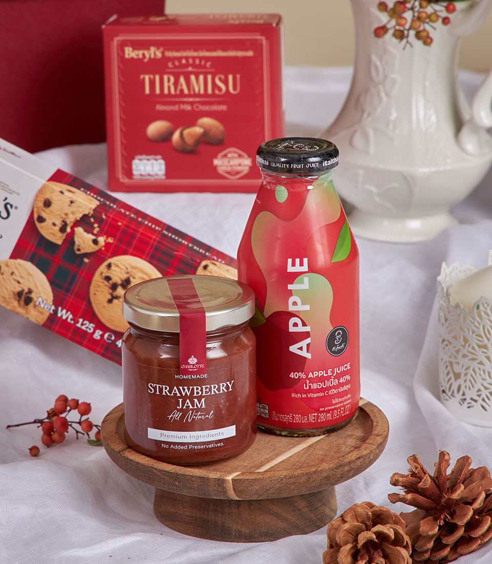 Red velvet luxury gift basket with tiramisu chocolates, strawberry jam, and festive treats for New Year