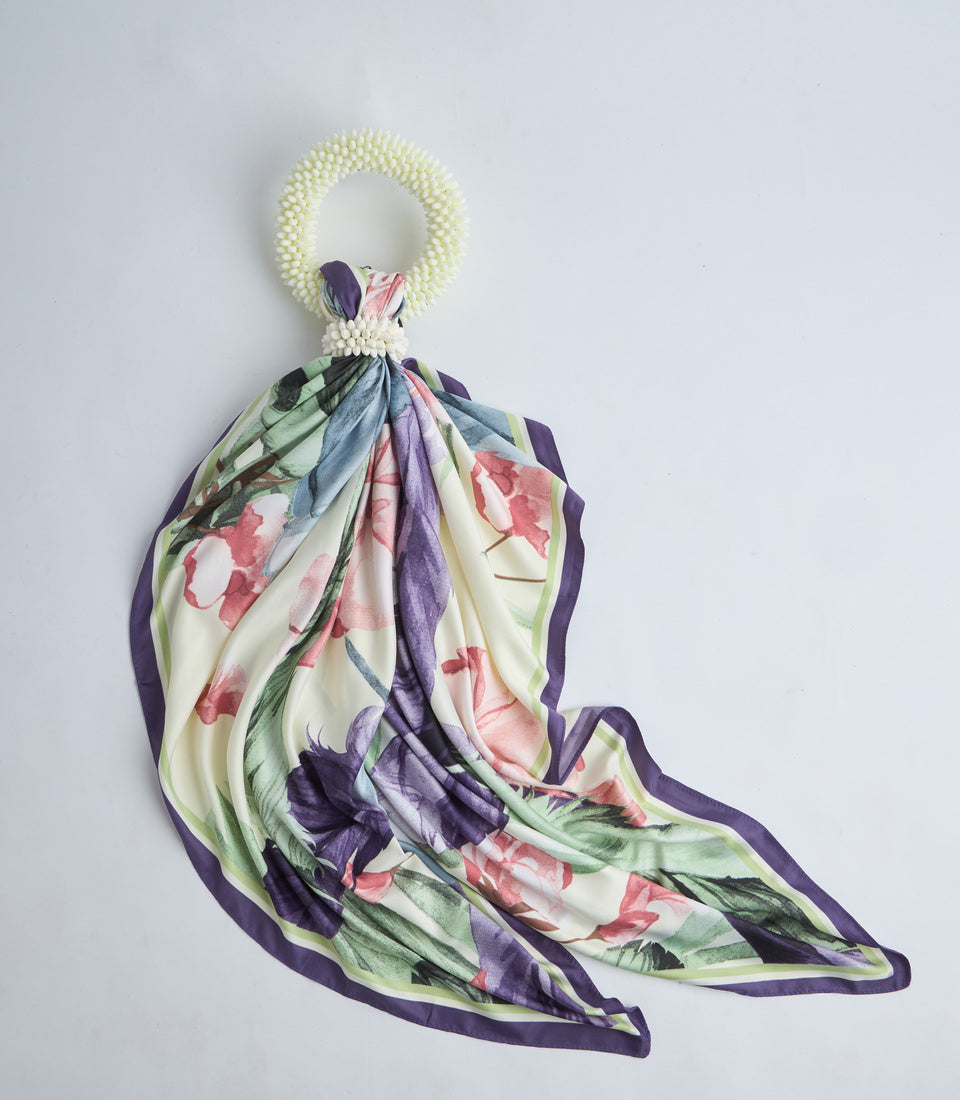 Floral silk scarf with pearl beaded ring holder, featuring pink roses, purple tulips, and green leaves on cream background with purple border.