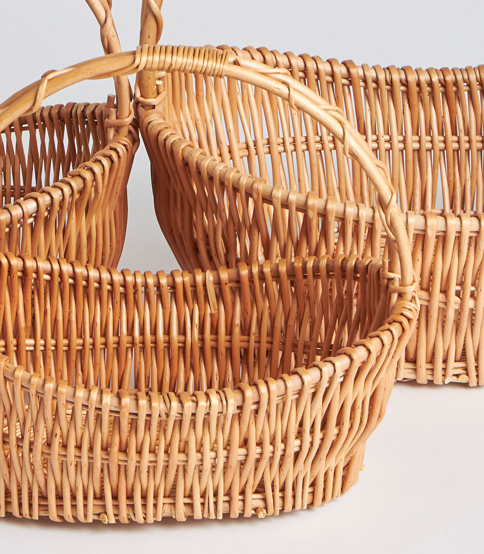 Natural woven wicker baskets with handles in light brown rattan, perfect for gift hampers and storage