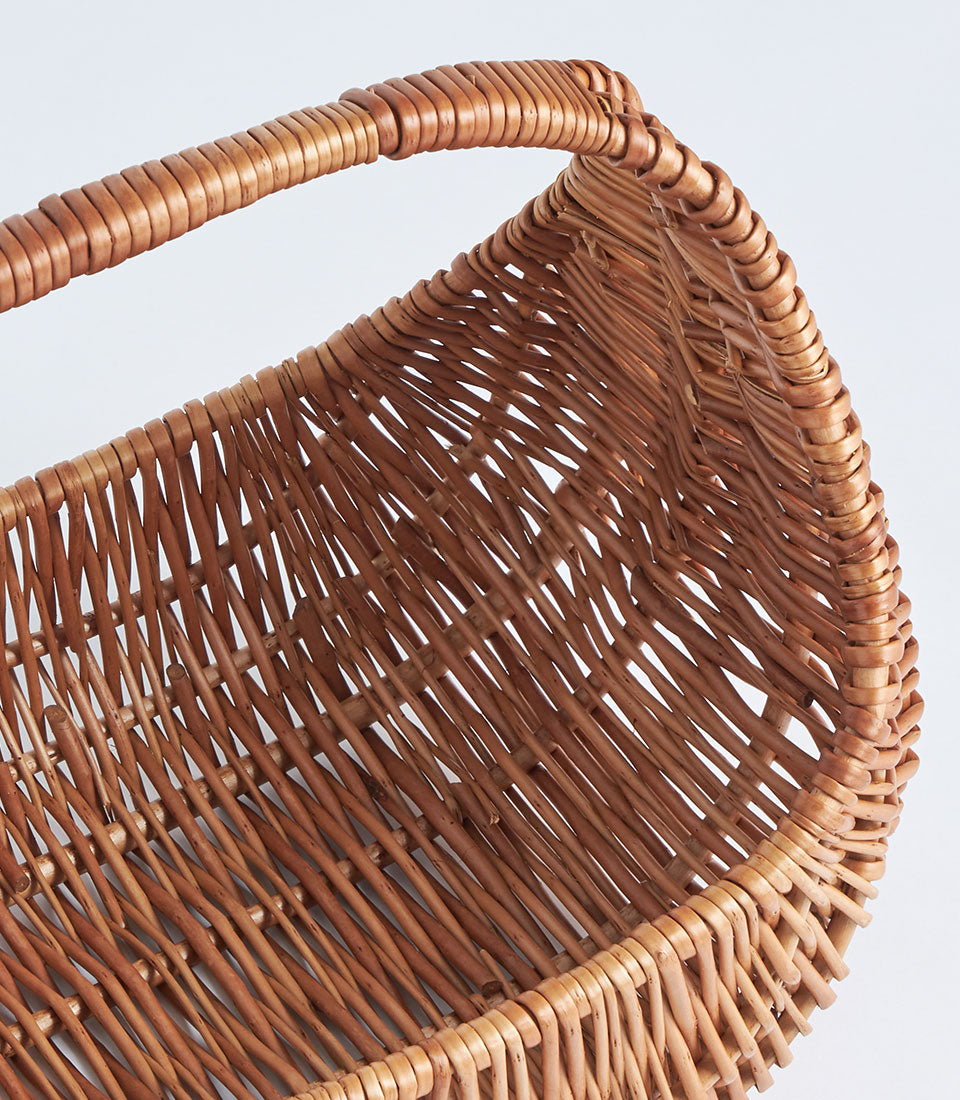 Handwoven natural wicker oval basket with sturdy curved handle for premium gift hampers