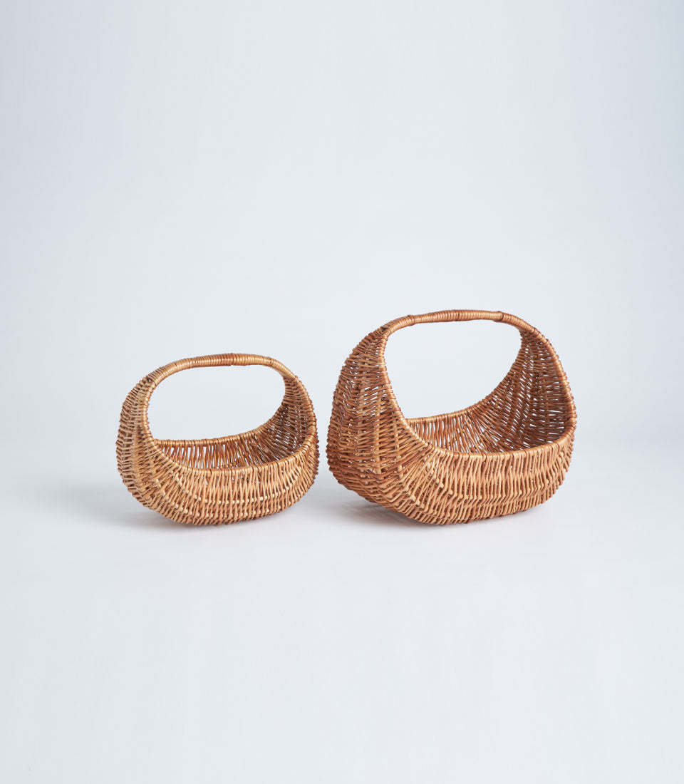 Light brown handwoven wicker baskets with oval handles, artisan gift presentation pieces