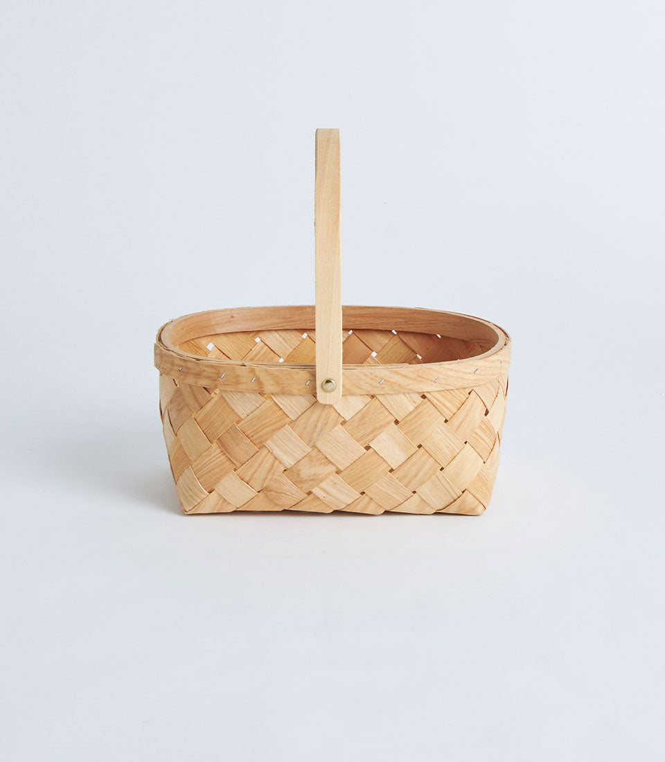 Light natural bamboo oval basket with woven handle for premium gift hampers