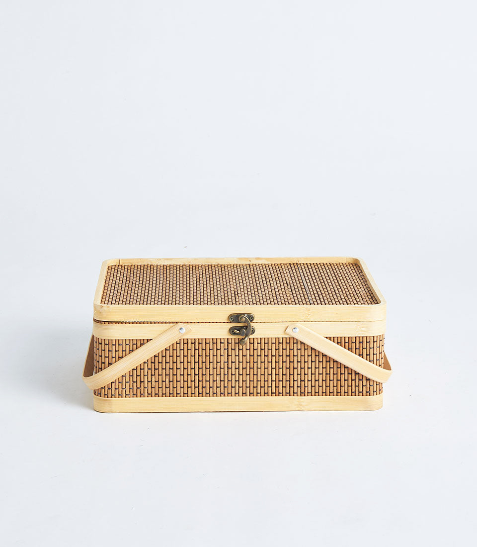 Handwoven rectangular bamboo gift basket with bronze clasp and dual handles