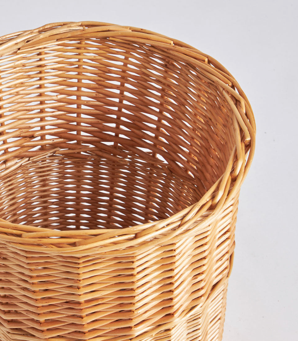 Natural light brown handwoven wicker storage basket with tight rattan weave and round opening