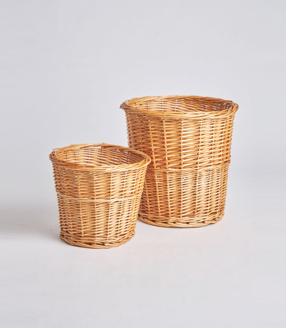 Handwoven natural rattan storage baskets in light brown, set of two cylindrical sizes