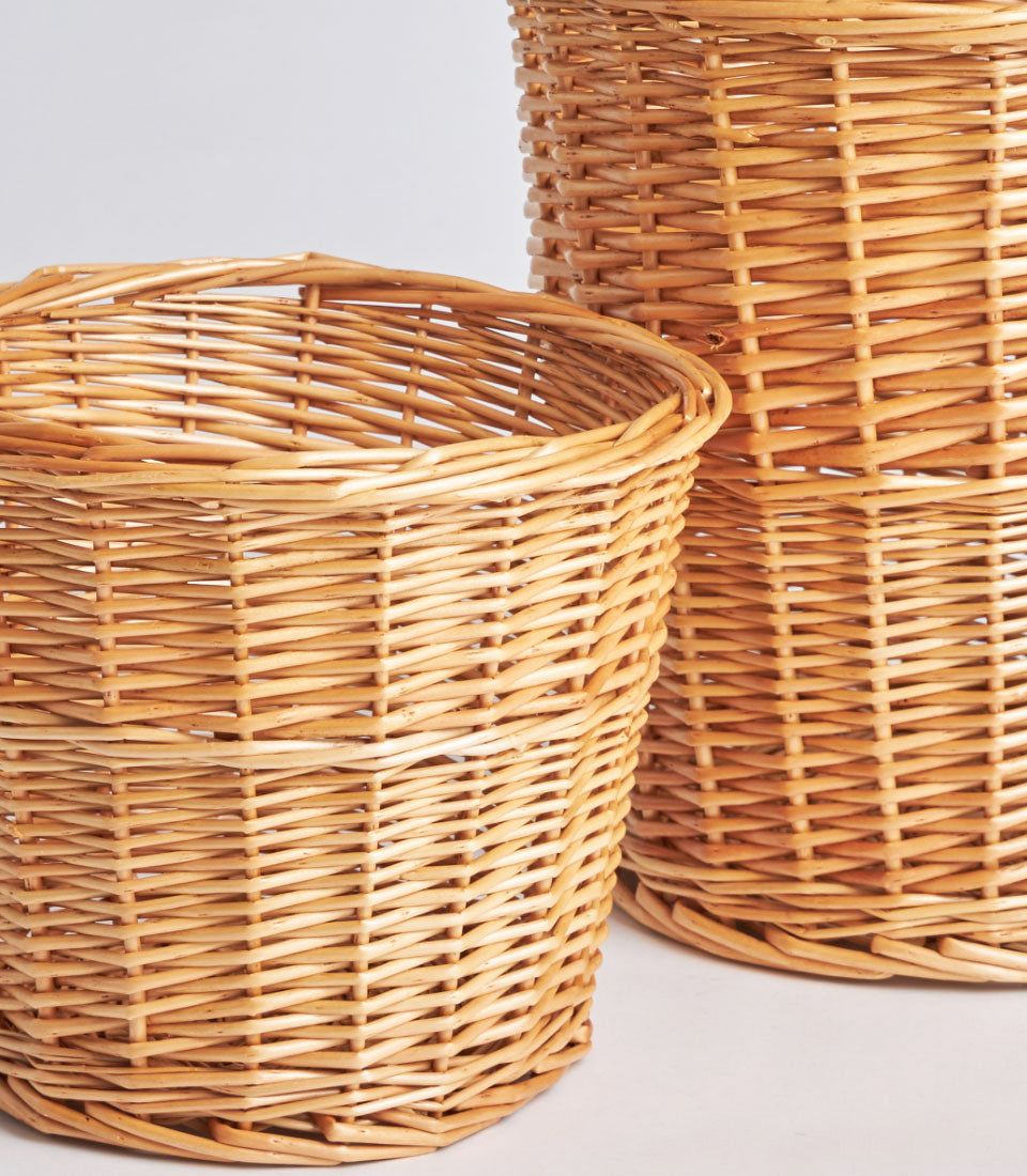 Natural wicker storage baskets in light tan, tightly woven artisan set of two varying heights