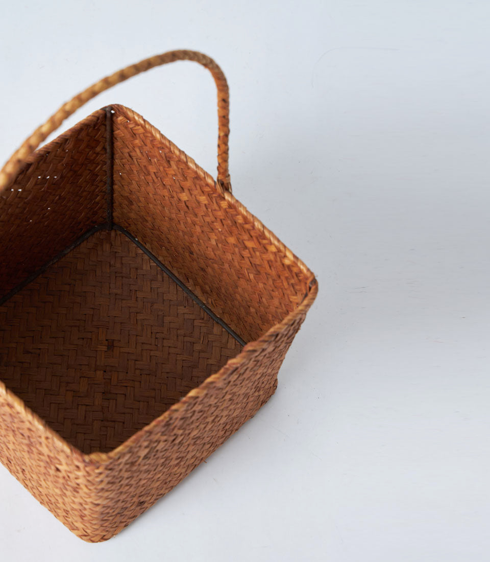Natural brown woven basket with handle, handcrafted artisan gift storage