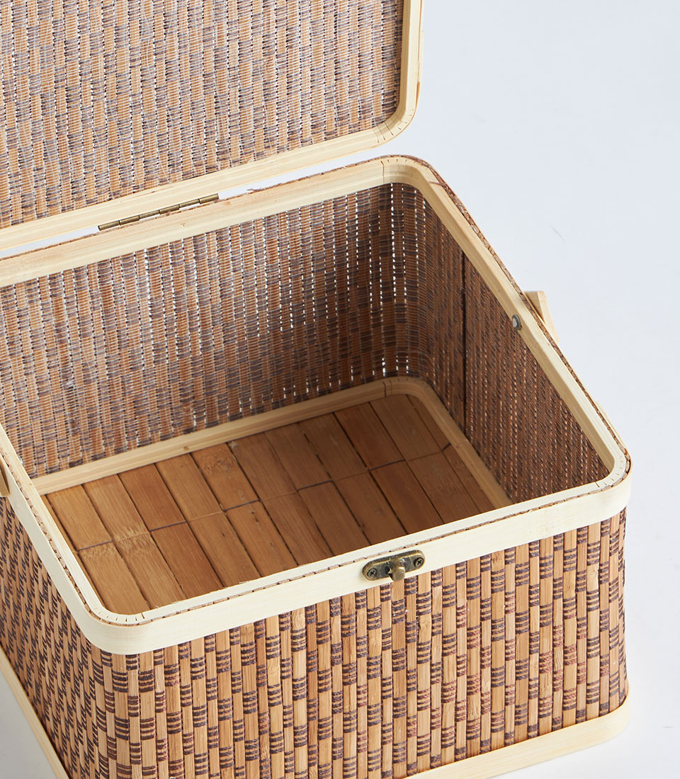 Woven bamboo picnic basket with wooden frame, brass latch, and hinged lid
