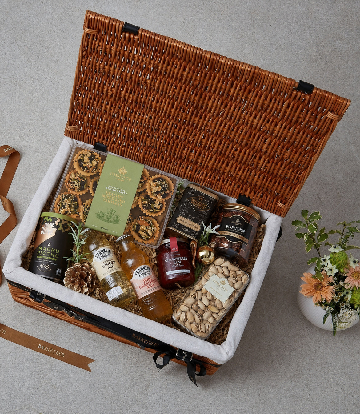 Basketeer luxury gift hamper in a woven wicker basket, filled with premium