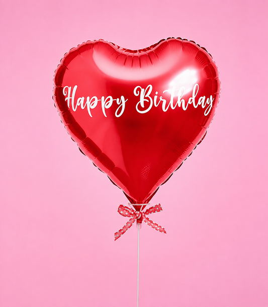 A vibrant red heart-shaped foil balloon with "Happy Birthday
