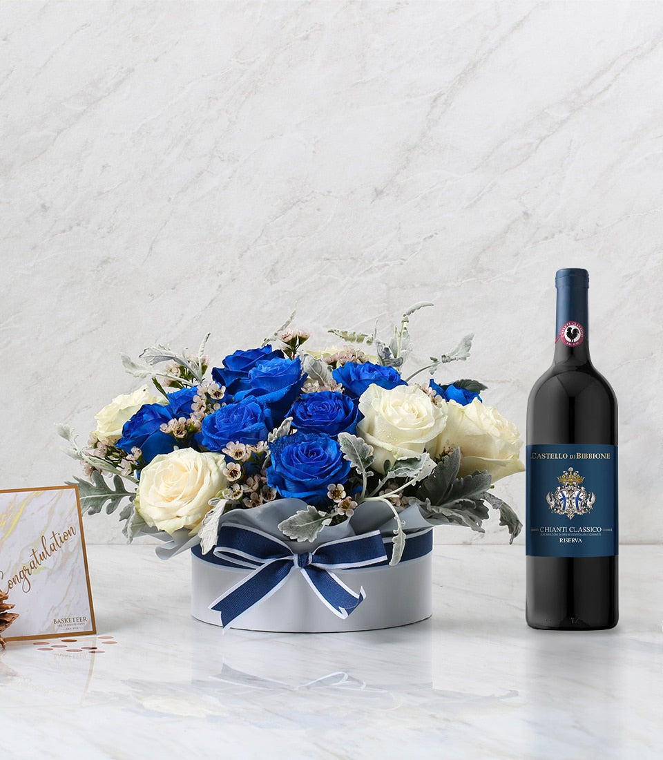 Chianti wine with blue and white rose bouquet in striped hatbox, anniversary celebration gift set