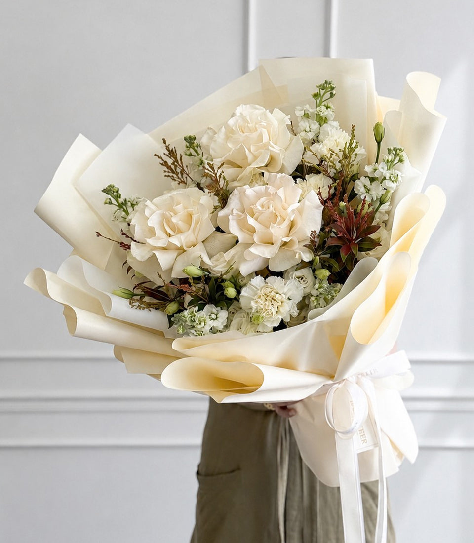 A premium white rose bouquet from Flowers by Basketeer, featuring delicate blooms