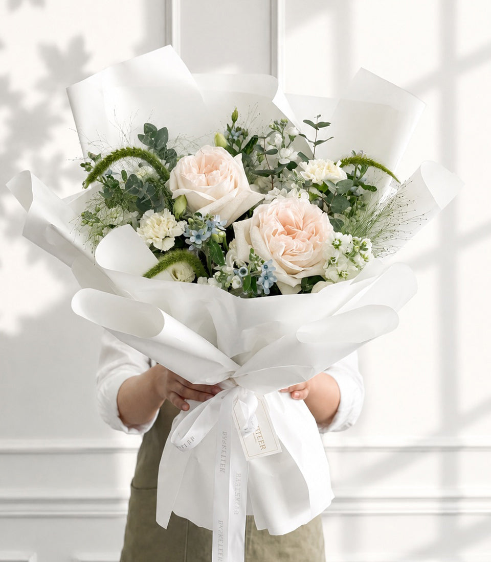 An elegant Flowers by Basketeer premium rose bouquet with soft peach garden roses