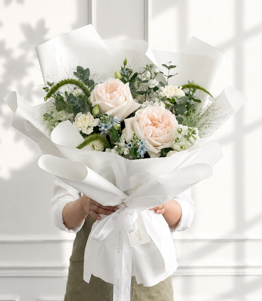 An elegant Flowers by Basketeer premium rose bouquet with soft peach garden roses