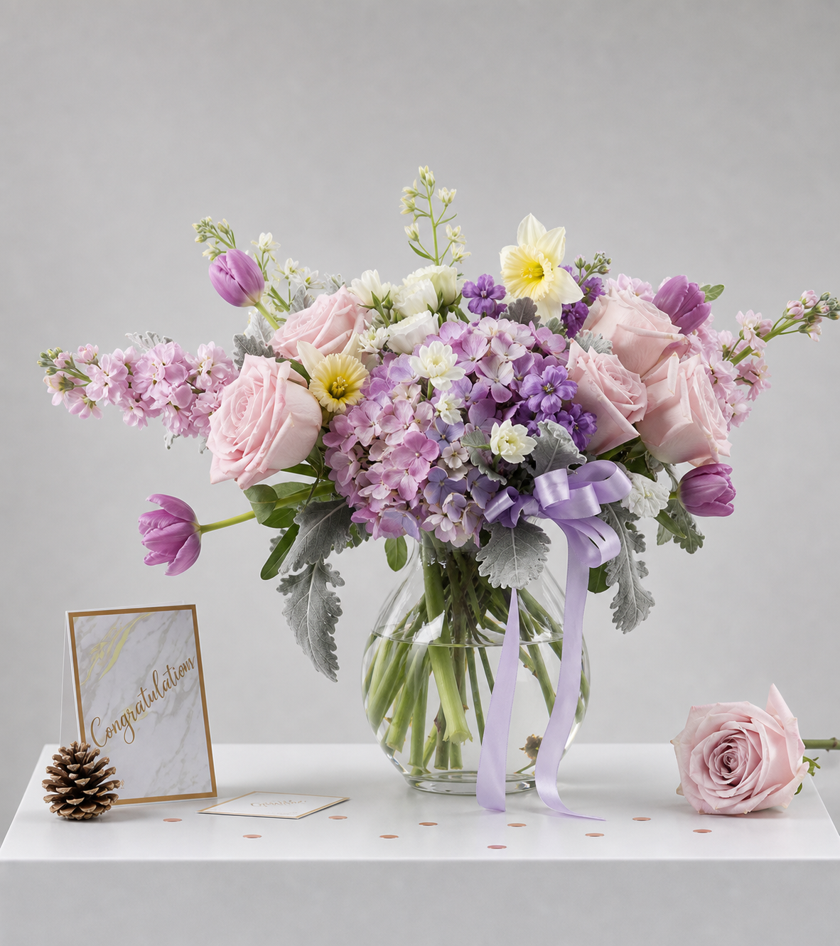 Elegant purple, lavender, and pink rose bouquet with hydrangeas, tulips
