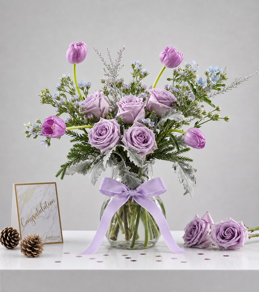 Elegant lavender rose and tulip arrangement with delicate blue fillers and silvery dusty miller in a