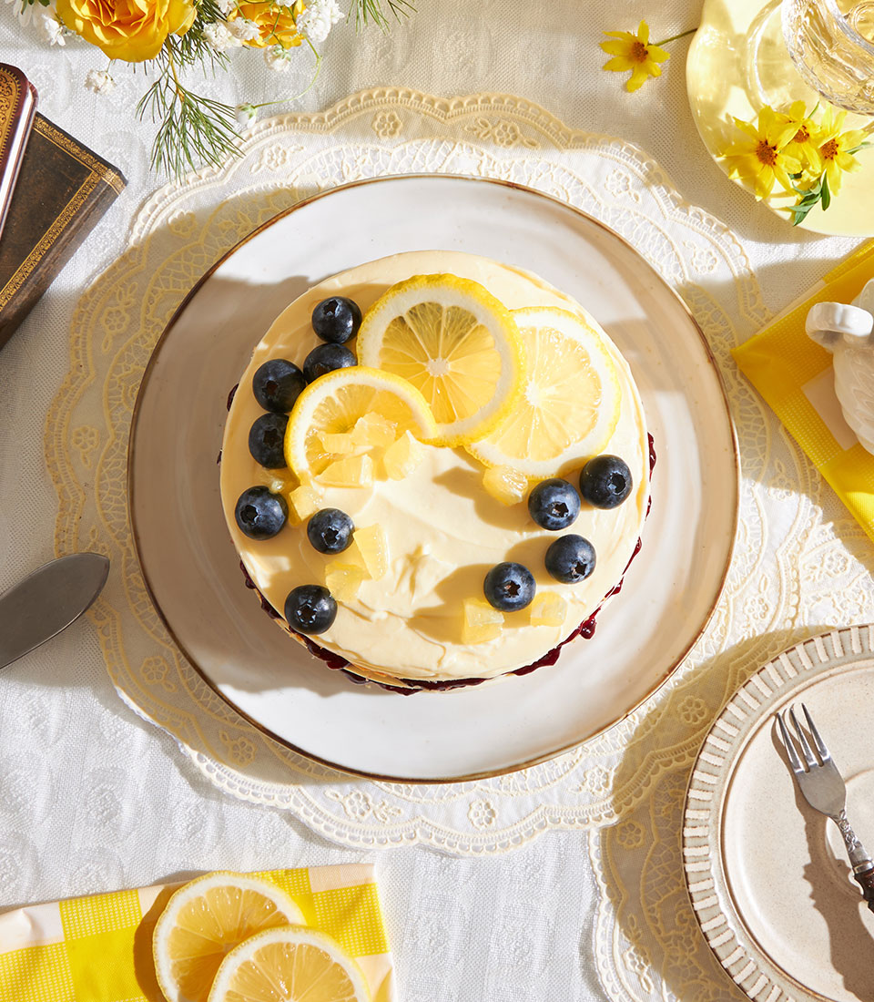 Lemon blueberry sponge cake with cream cheese frosting, fresh blueberries and candied lemon, Charlotte Bakery gift