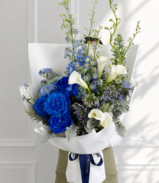 Royal blue roses and white calla lilies bouquet with delphiniums